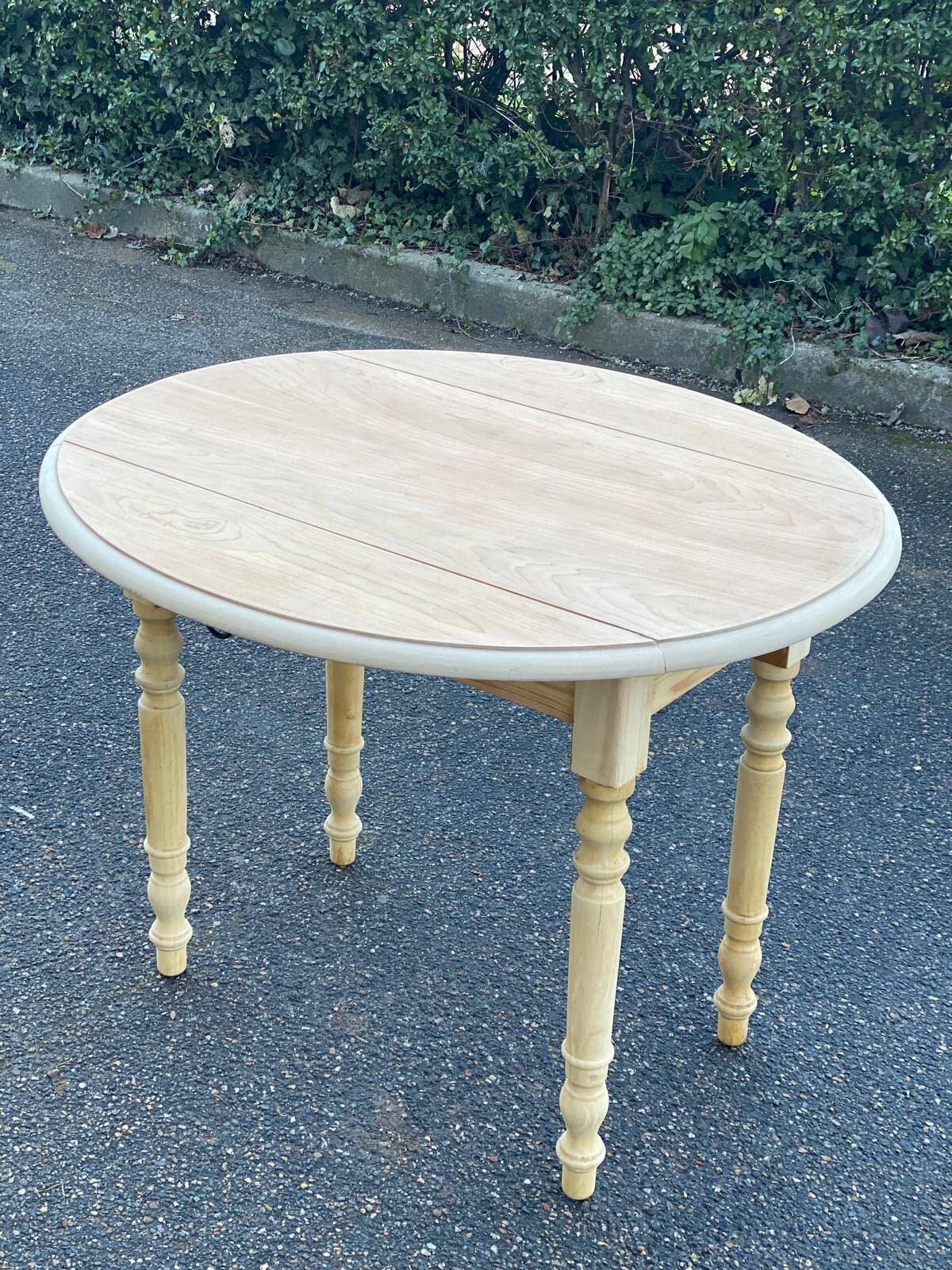 Round table with flaps or shutters renovated in raw solid wood