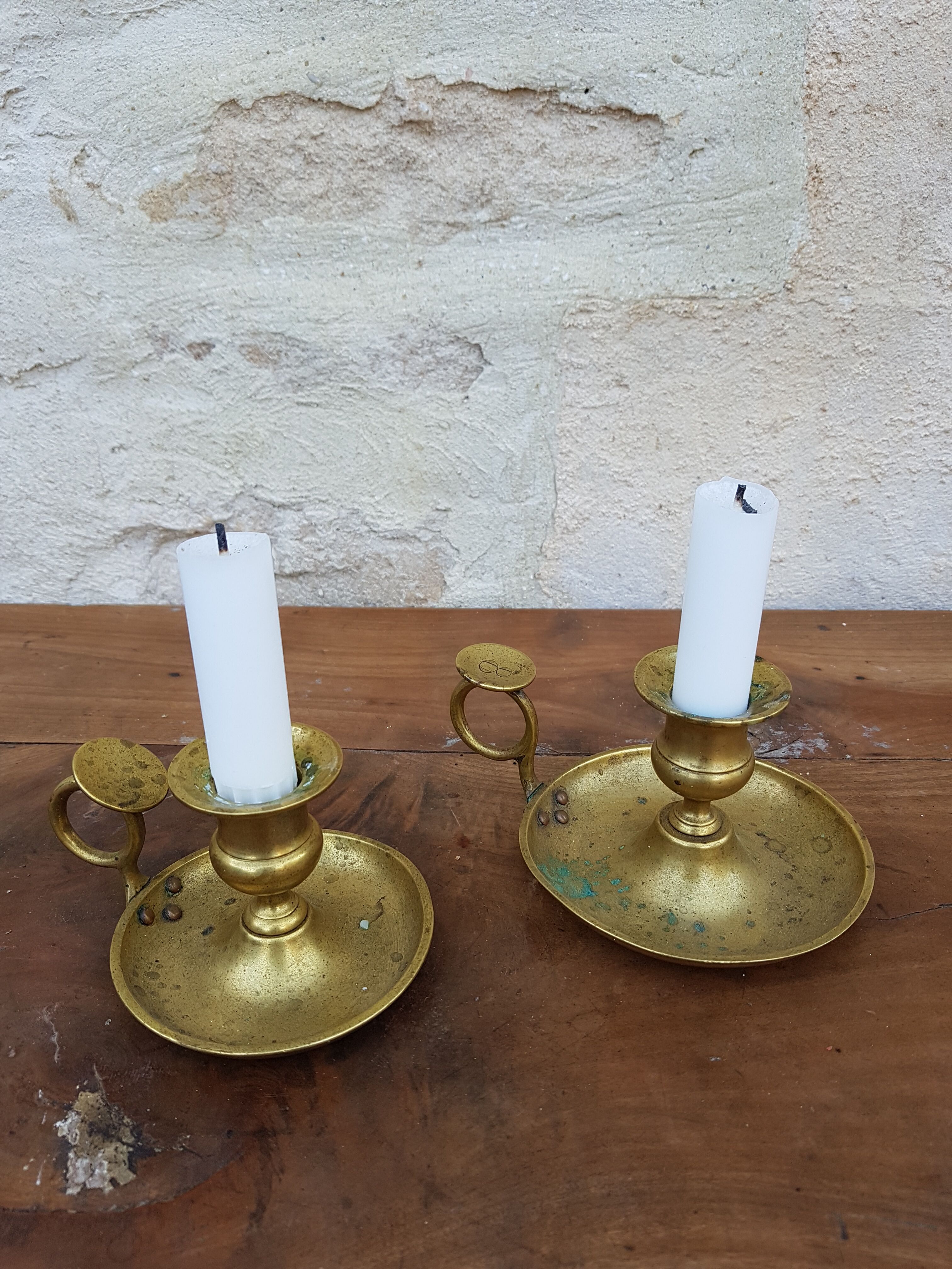Old pair of brass candlesticks cellar rats