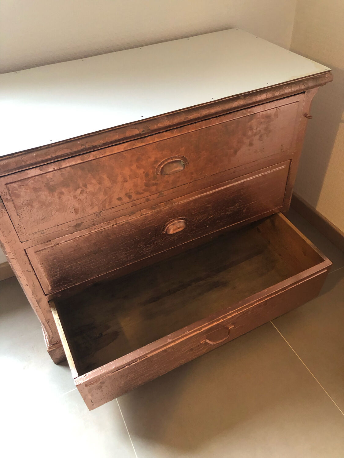 Old chest of drawers restored golden copper color