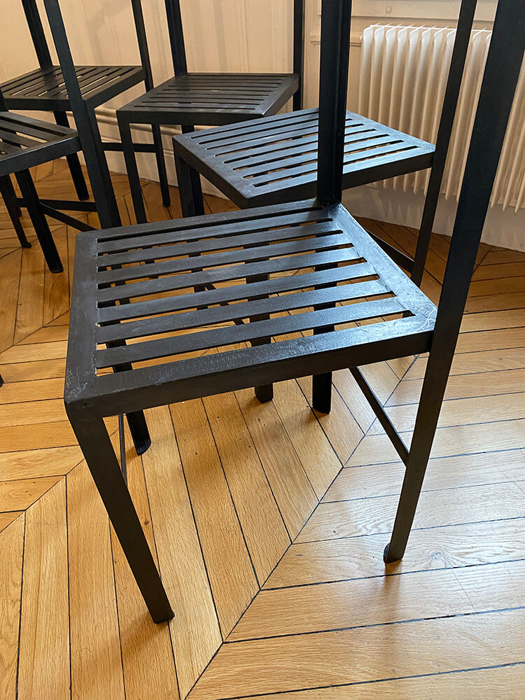 Set of 8 patinated and waxed raw steel chairs