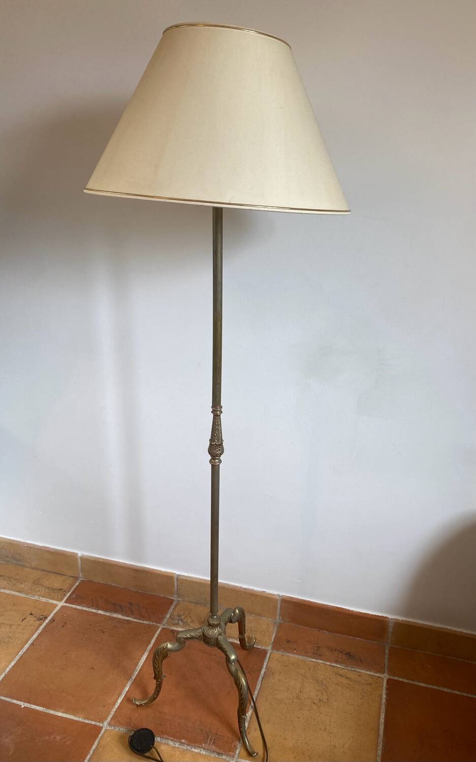 Gold-colored iron floor lamp