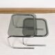 Pair of nesting tables in smoked glass and chrome legs.