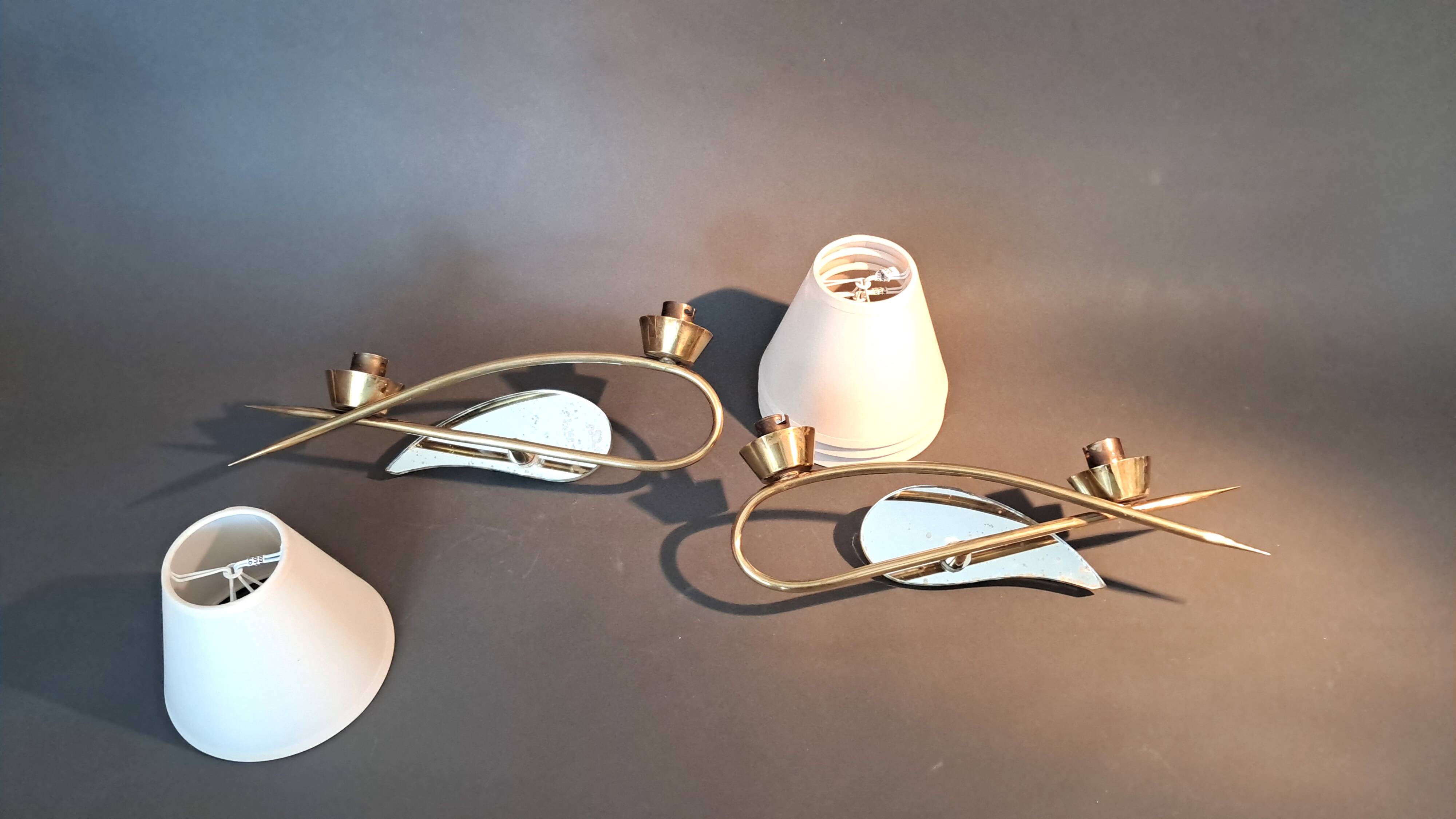 Pair of gilded brass and mirror wall lights, Circa 1960.