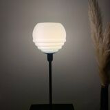 Table lamp with a vintage powder blue globe and a black base
