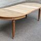 Large stripped solid oak dining table in Louis XVI style with 3 extensions.