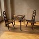 Vintage sculptural wooden table and two chairs, hand-carved loop backrests