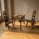 Vintage sculptural wooden table and two chairs, hand-carved loop backrests