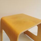 Design stool/side table made of curved plywood.