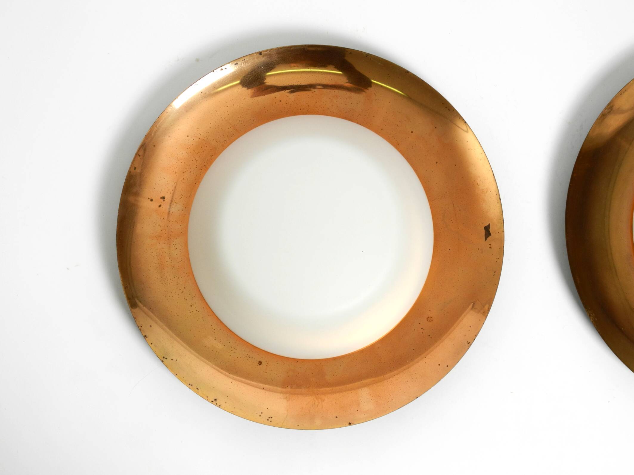 Pair of Mid Century wall or ceiling lamps made of glass with copper-plated