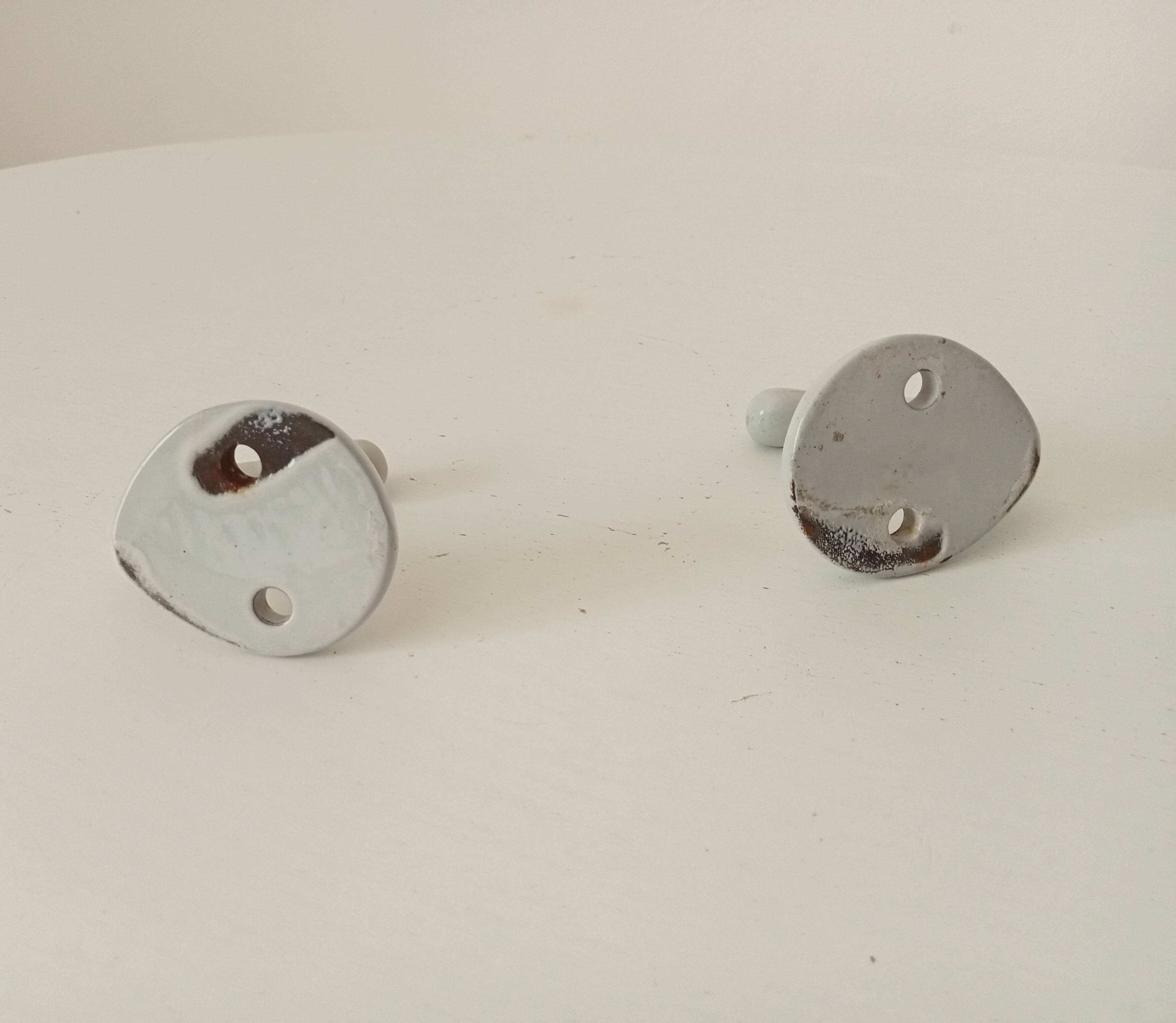 Antique enamelled cast iron wall hook from the 30s/40s