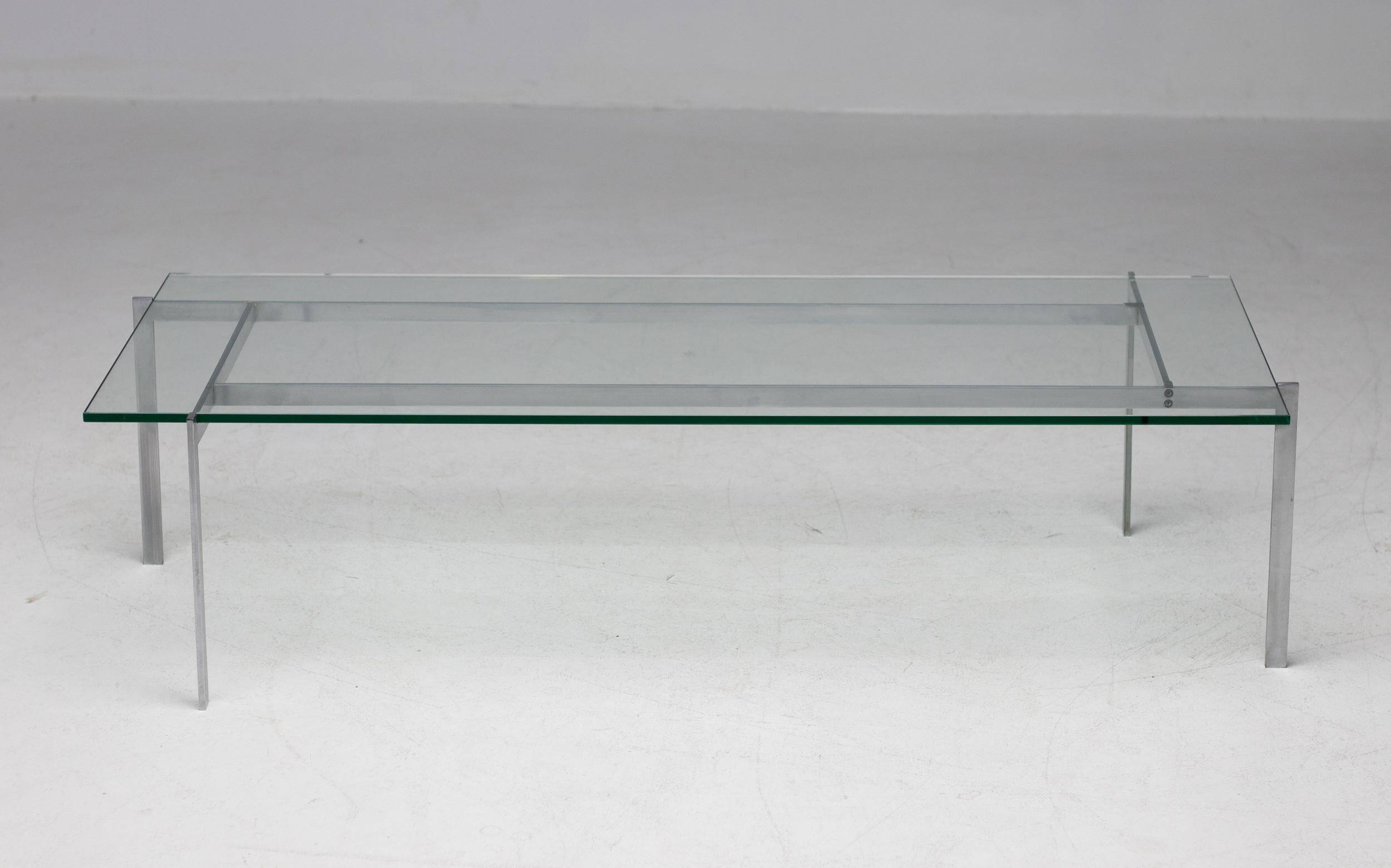 Architectural rectangular coffee table in steel and glass.