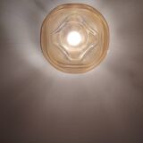 Textured amber globe wall light