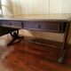 table-tier English lion feet, cherry and leather