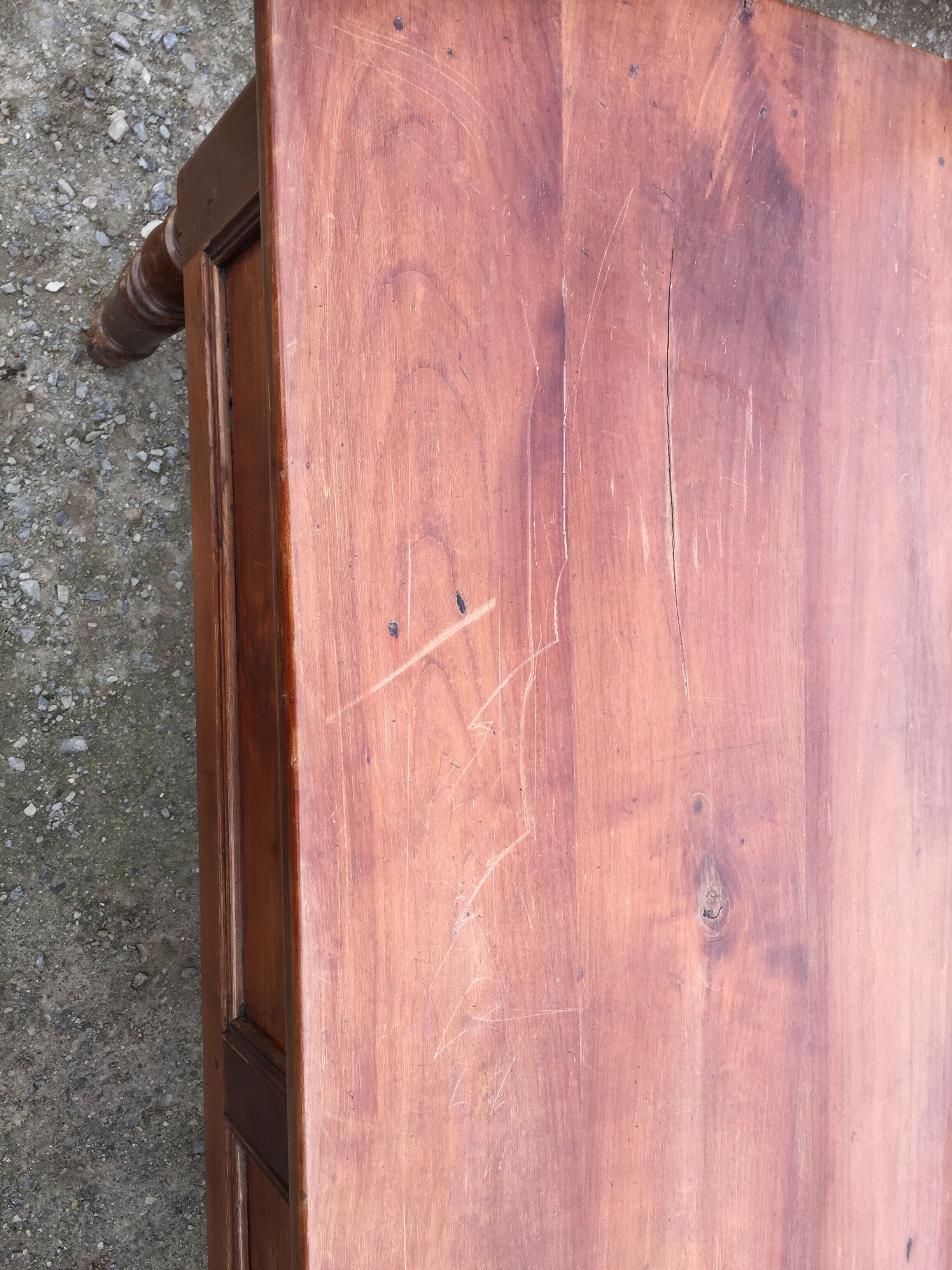 Old farmhouse table with cherry and chestnut panels with 3 drawers.
