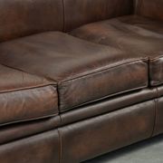 Set of a smooth chesterfield sofa and armchair with a timeless English look