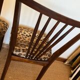 Pair of vintage wood and leopard chairs
