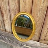 Antique gilded oval mirror