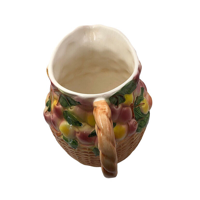 Vintage pitcher in cherry patterned dabbling