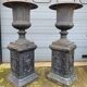 Large antique cast iron vases on pedestal