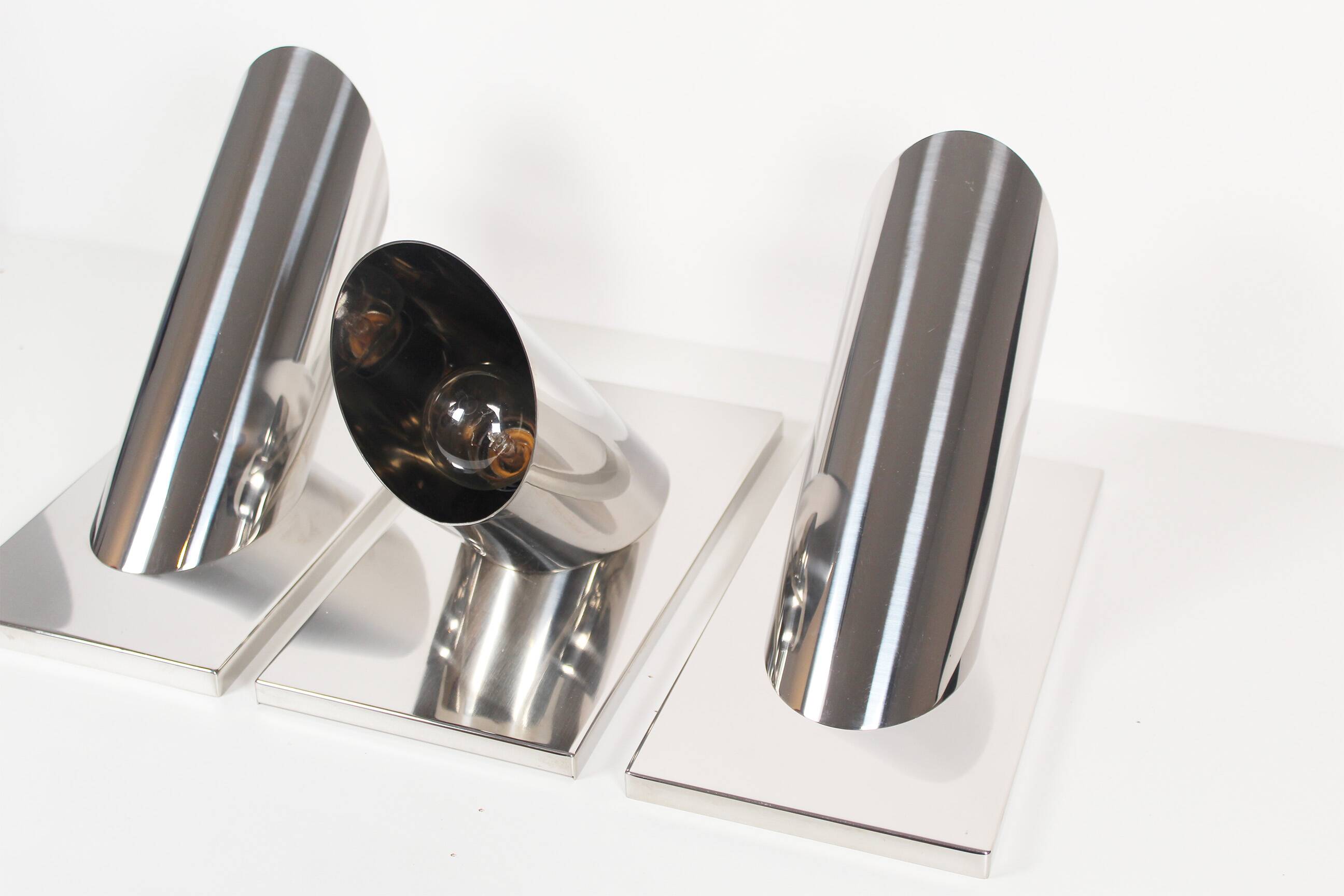 Set of three large sculptural vintage chrome metal wall lights