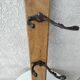 antique coat rack with 3 cast iron hooks
