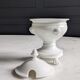 White porcelain confiturier with lion paws and masks. 19th century.