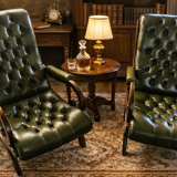 Pair of tufted leather armchairs in Chesterfield / English club style.