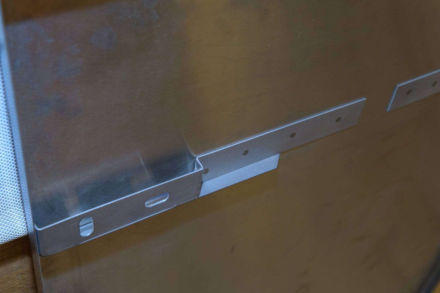 large smoked mirror on brushed aluminium