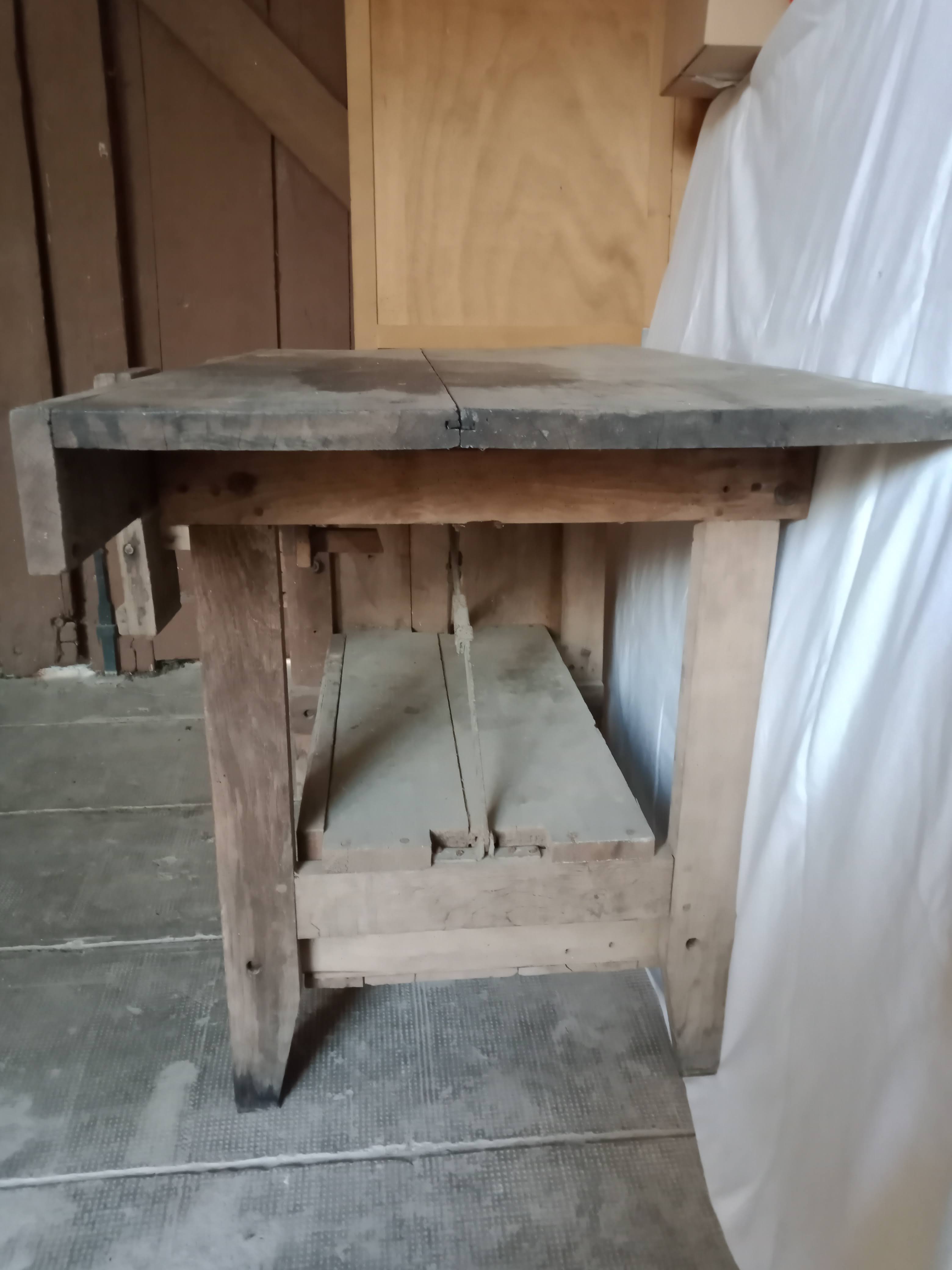 antique workbench with one drawer and two vices