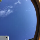 Natural rattan oval mirror bound