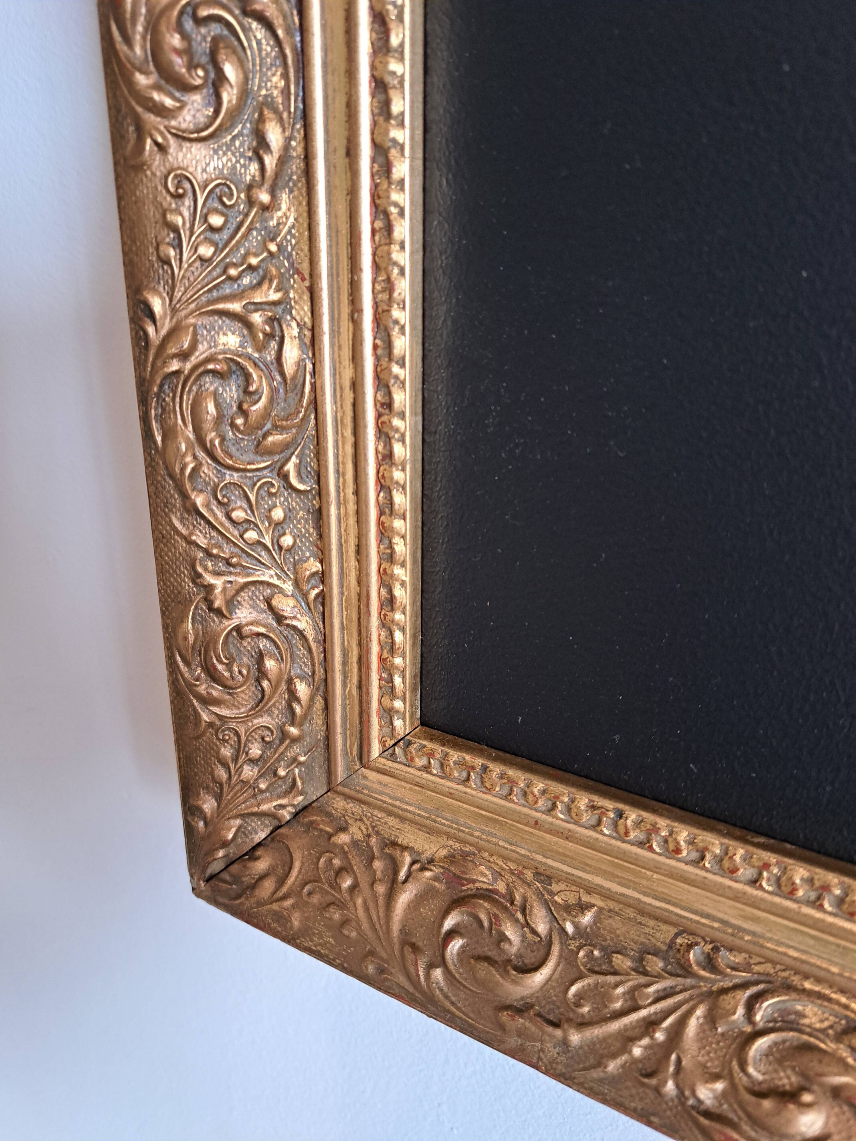 Slate table framed in gold leaf style