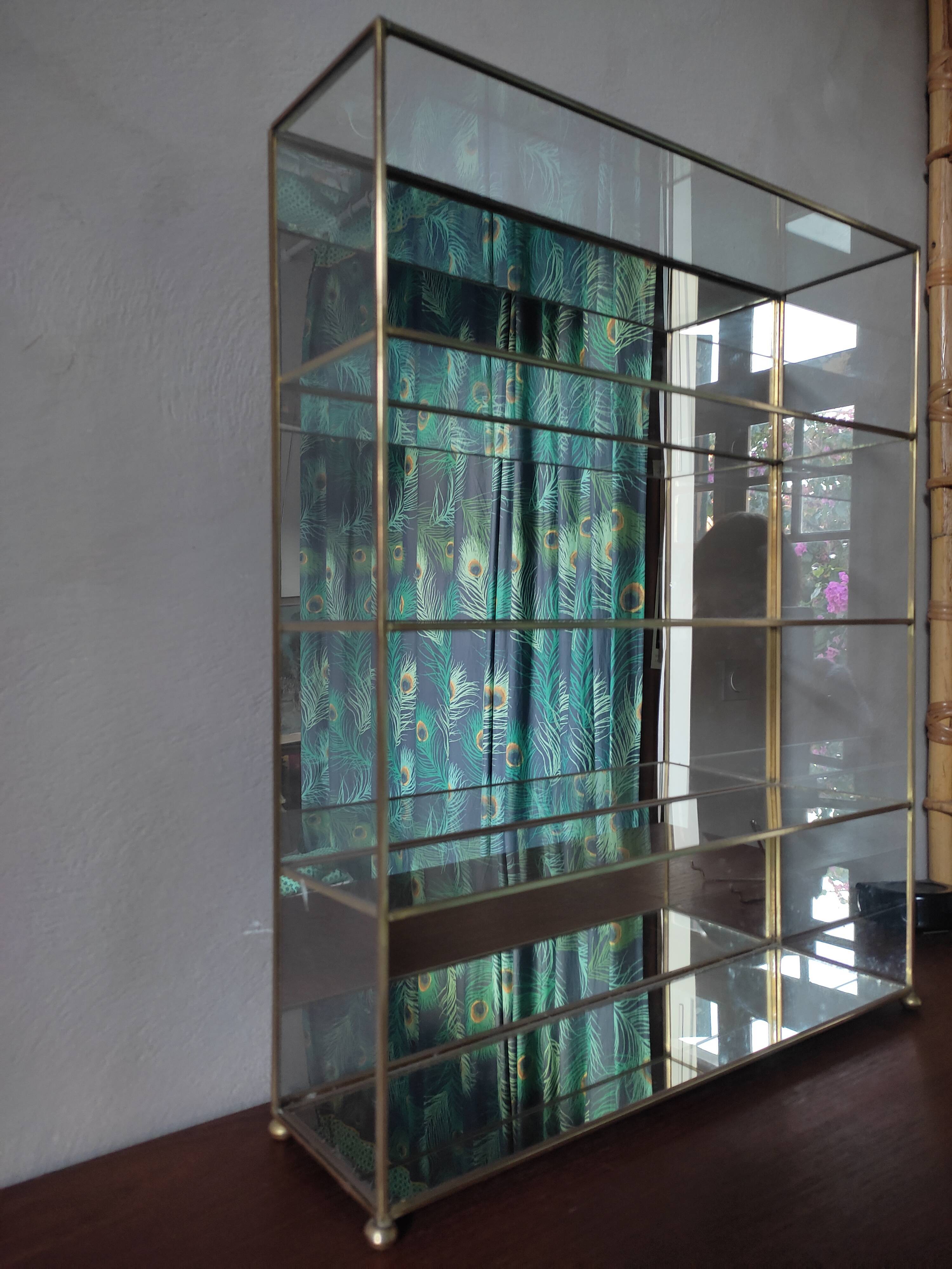 Glazed brass shelf to install