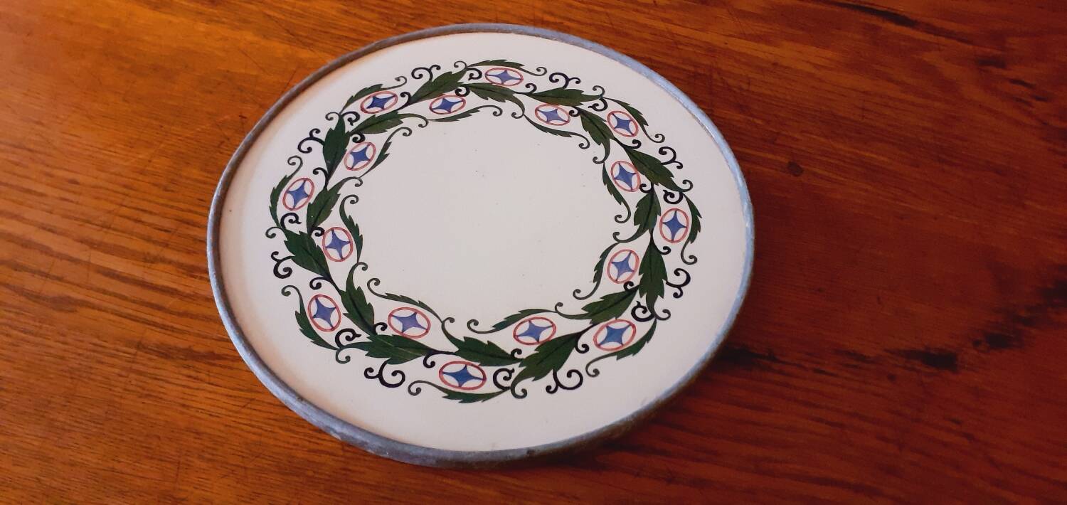 Porcelain and zinc trivet circa 1900