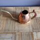 Copper and brass watering can