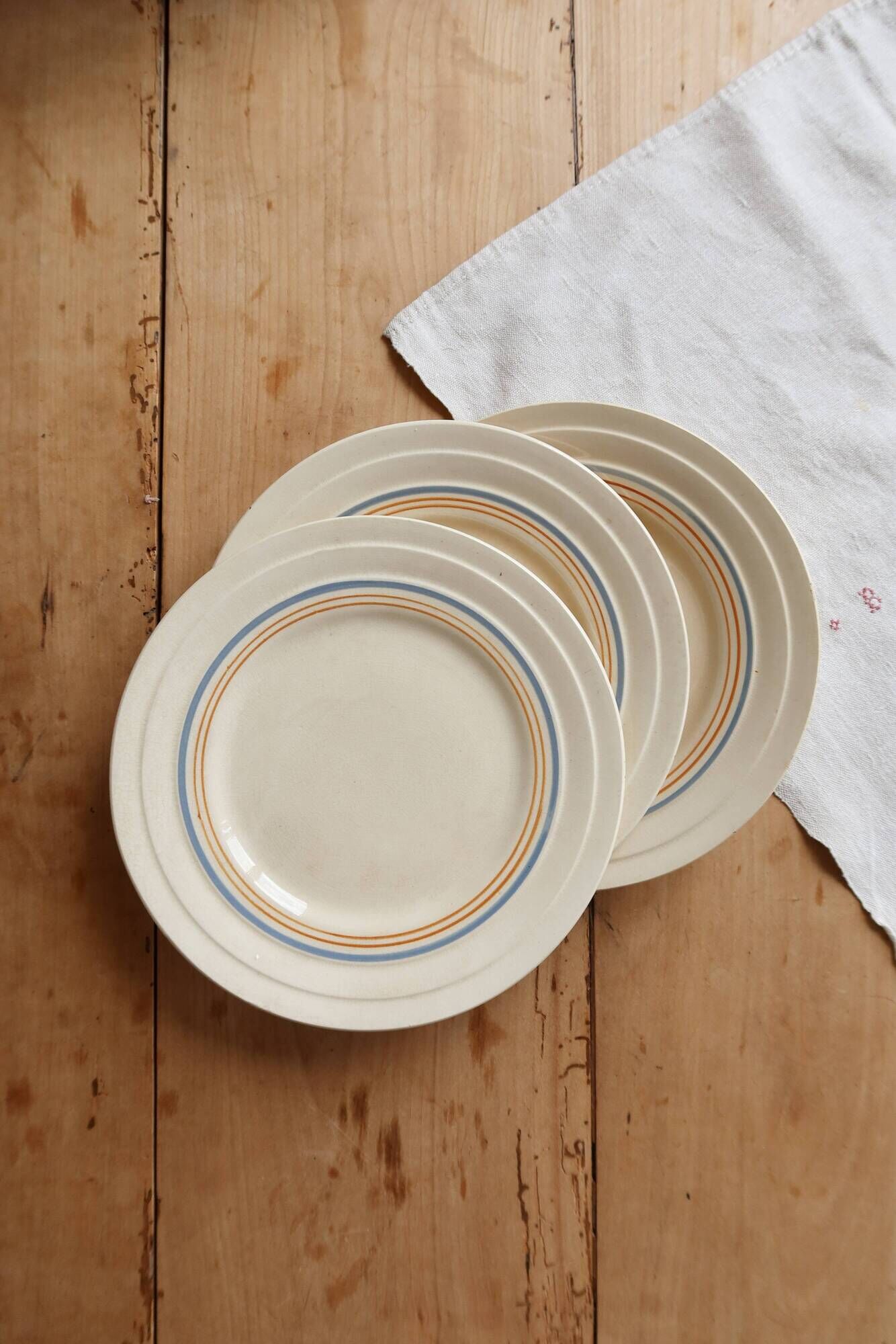 Ivory ironstone dessert plate – Pale blue and orange borders