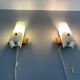 Mid-century wall lights in white plexiglass with a wooden base, 1960s, Germany.