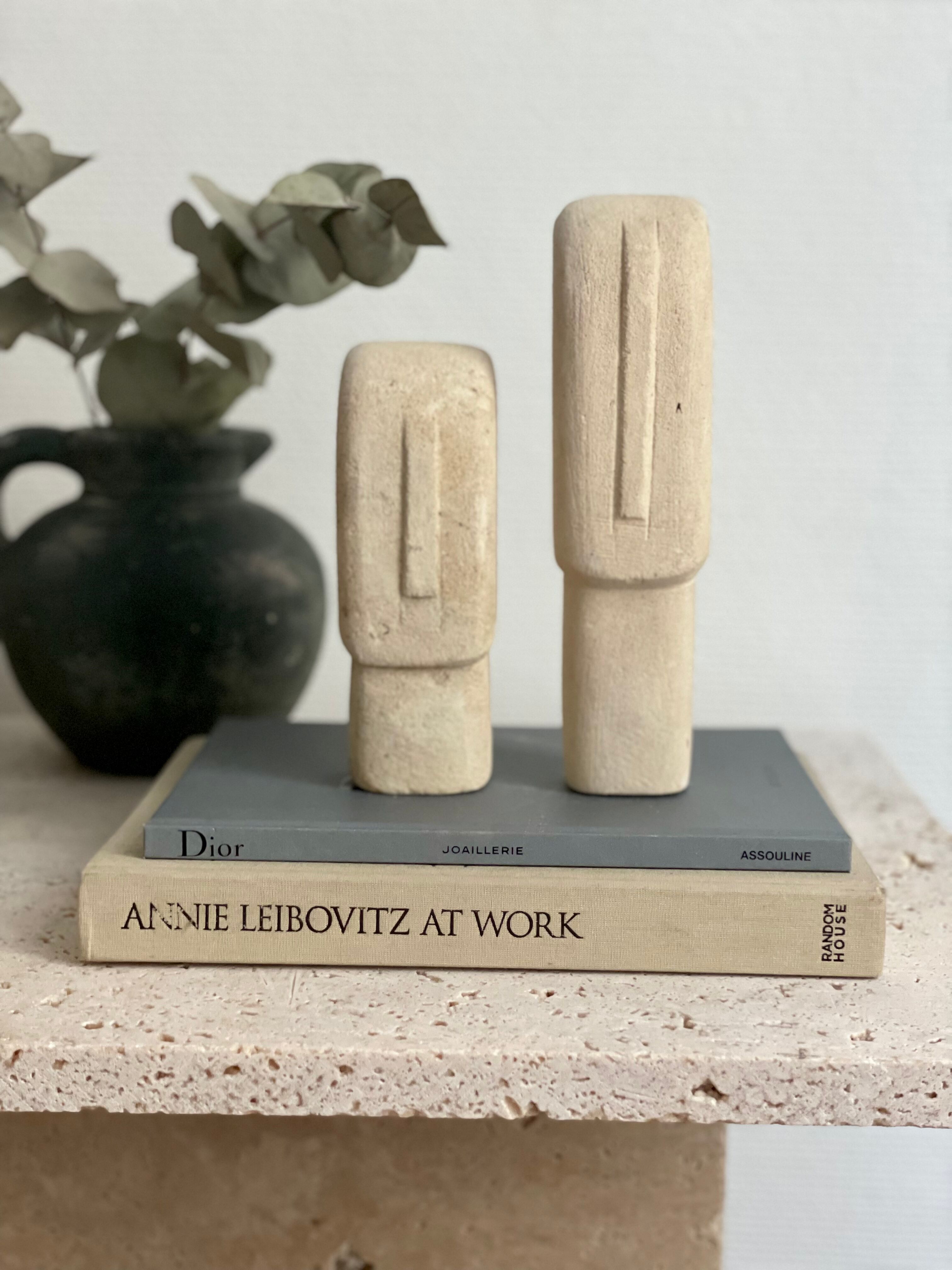 Set of two minimalist stone face statues