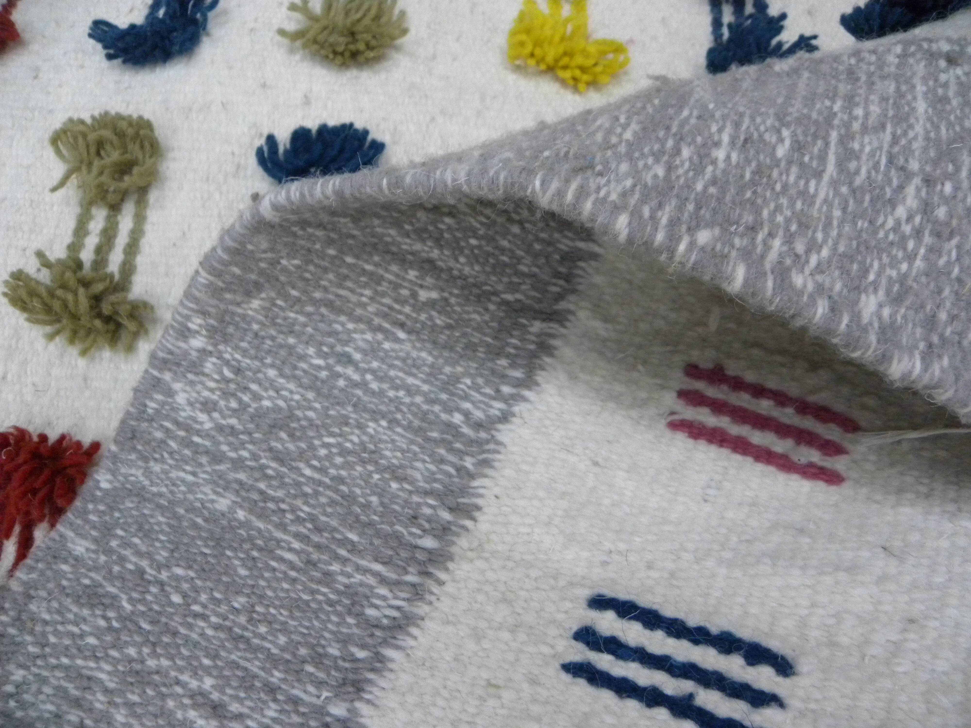 Handwoven Modern Boho Wool Rug with Colourful Patterns and Pompoms