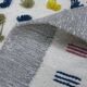 Handwoven Modern Boho Wool Rug with Colourful Patterns and Pompoms