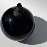 Old lamp foot shaped ball in black glass