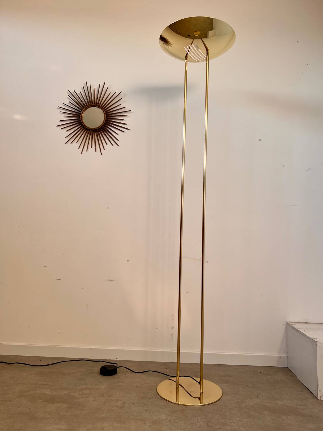 Old golden brass floor lamp with Italian design bulb from the 70s vintage