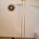 Old golden brass floor lamp with Italian design bulb from the 70s vintage