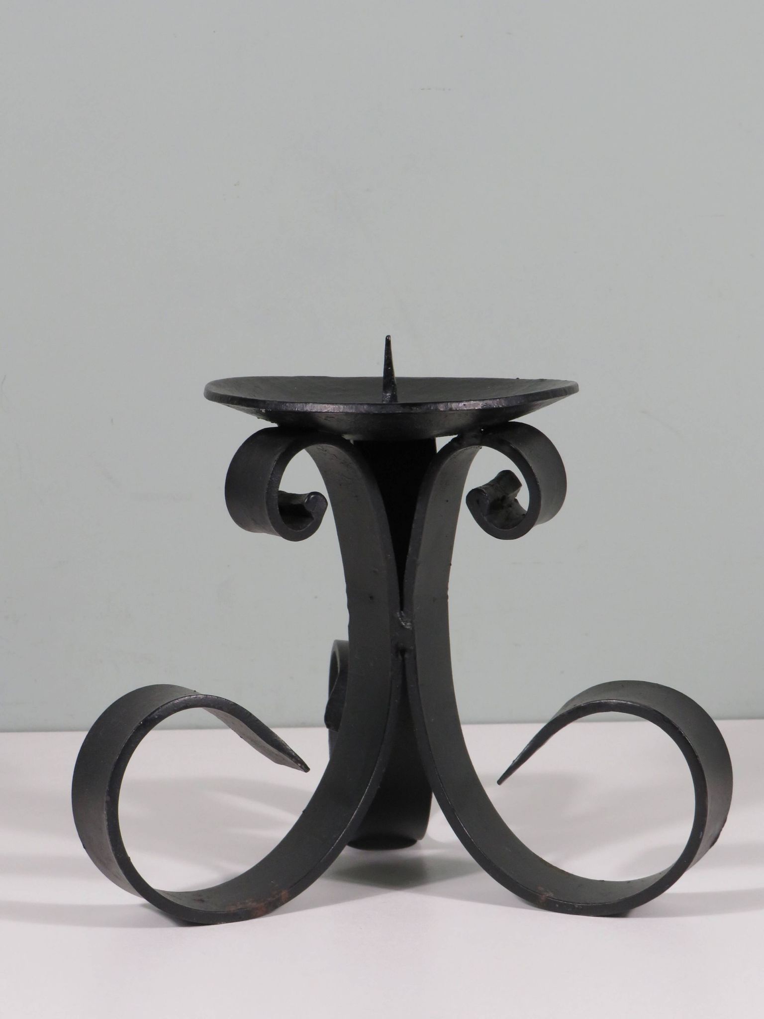 Vintage wrought iron chandelier for large candle.
