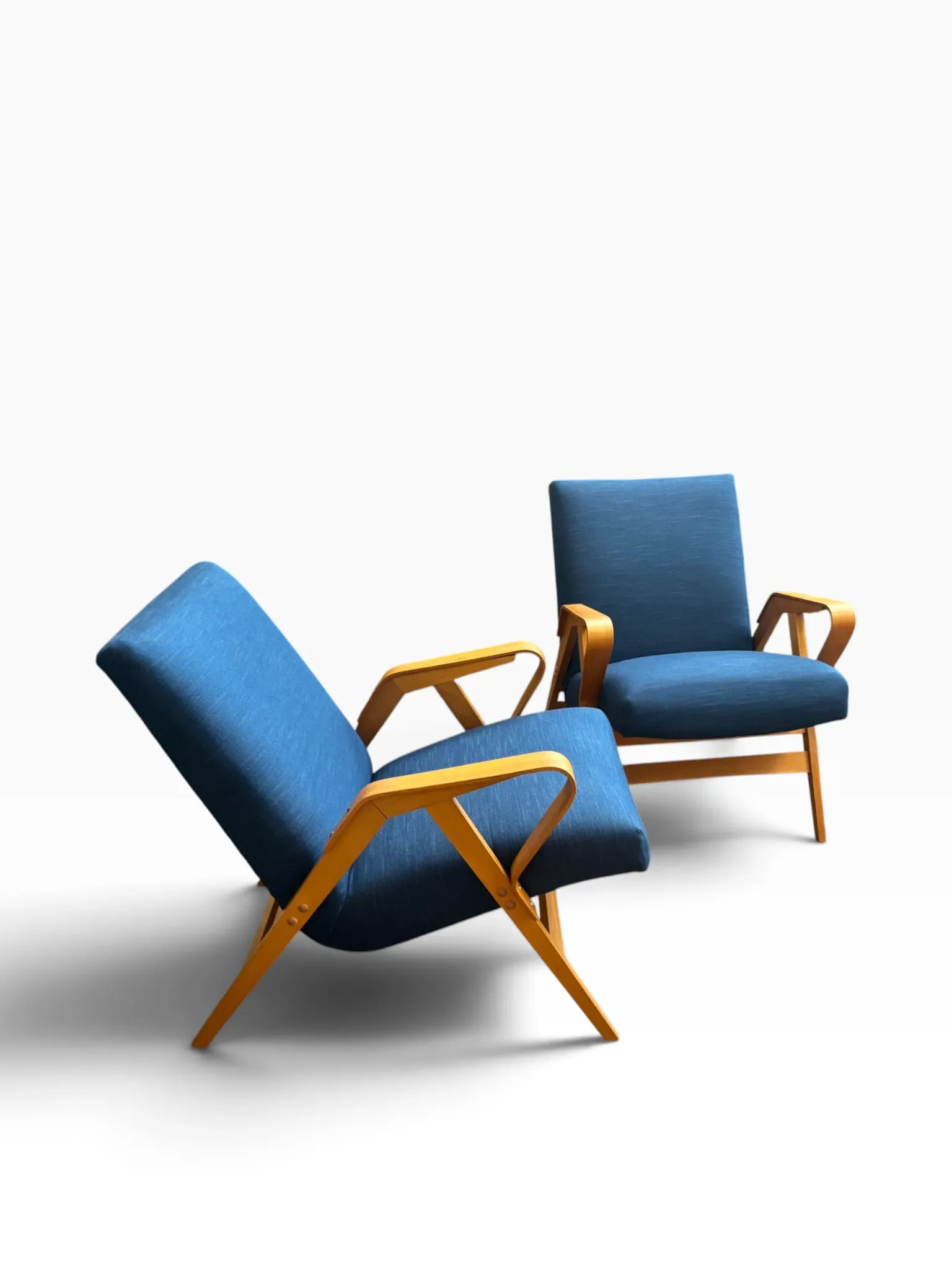 Set of 2 blue lounge chairs restored by František Jirák for Tatra Nabytok.