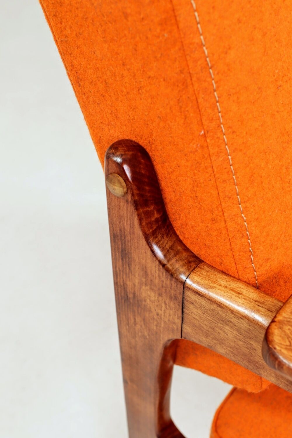 Vintage armchair in papaya orange wool from the 1960s.