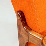Vintage armchair in papaya orange wool from the 1960s.