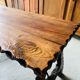 Table basse brutaliste en bois et fer forgé