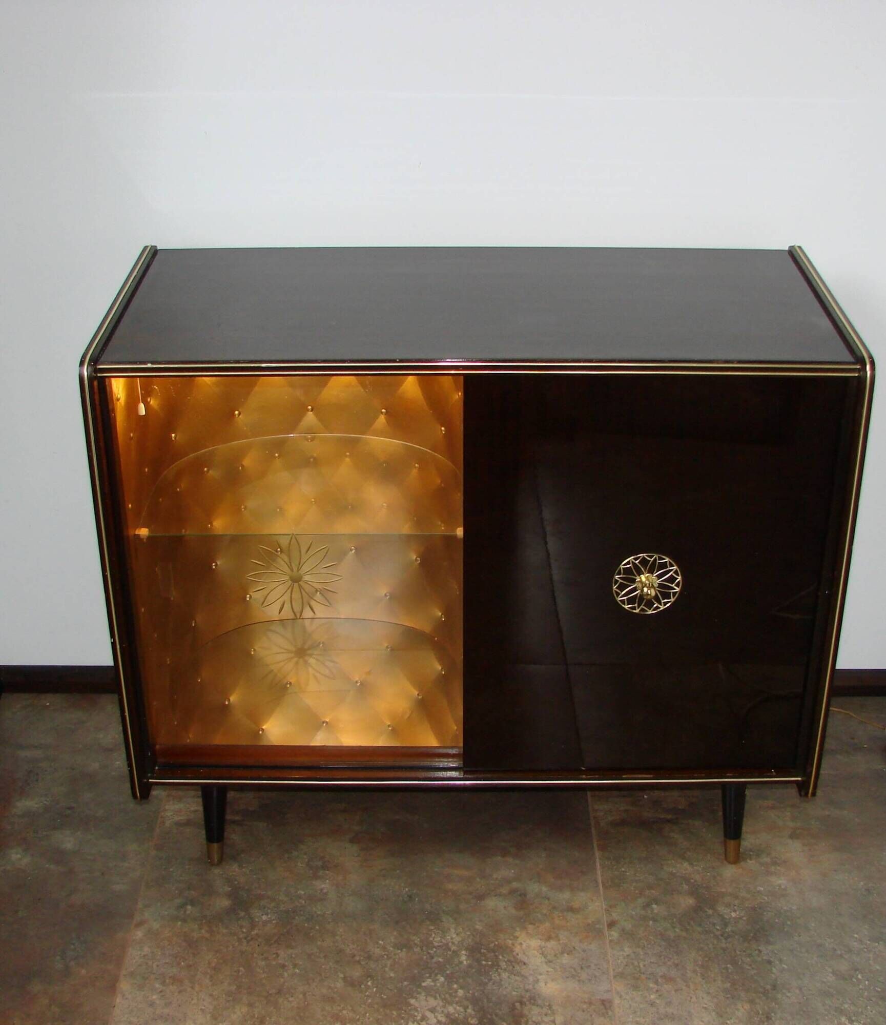 A vintage cabinet with a record player and a bar, 1960s.