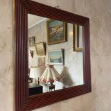 Mirror in wood and brass