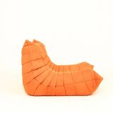 Togo sofa set and armchairs in pumpkin orange, 3 pieces, no label.